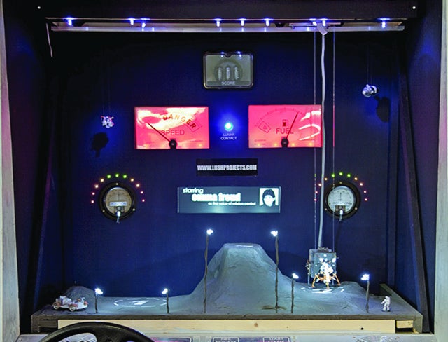 Electrical gauges that display speed and fuel levels on a real-life Lunar Lander game.