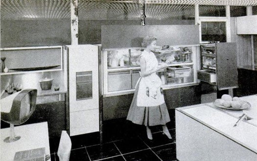 In 1955, General Motors featured another Kitchen of Tomorrow at its Motorama show, and this model contains elements that have yet to become a part of today's kitchens. Most notably, you can open the refrigerator or answer the phone simply by waving your hand around. A tray hanging from the ceiling transports heavy appliances and ingredients. To the far left is the housewife's intercom center, which uses a rotating TV to let her know what's going on in other parts of the house. Read the full story in <a href="http://books.google.com/books?id=NCYDAAAAMBAJ&amp;lpg=RA1-PA44&amp;dq=housewife%20kitchen%20intitle%3APopular%20intitle%3AScience&amp;pg=RA1-PA44#v=onepage&amp;q&amp;f=false">"Dream Kitchen--No Bend, No Stretch--Almost Runs Itself"</a>