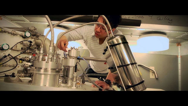 IBM researcher Jerry Chow preps a dilution refrigerator for a quantum experiment. The refrigerator will take the experiment down to just 10 to 15 millikelvin.