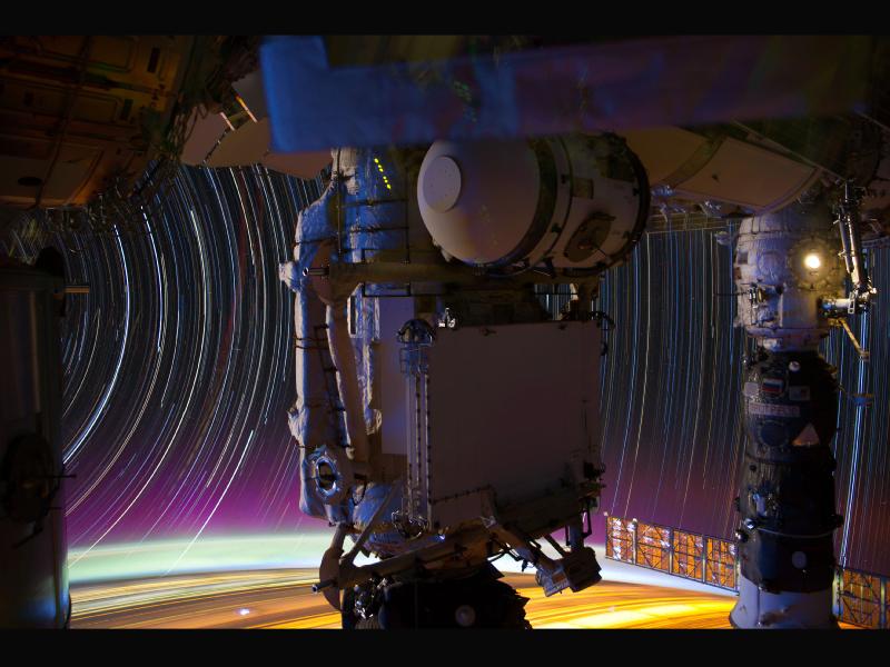 This long-exposure shot--like, 10-15 minutes--shows the Mini-Research Module (MRM1, center) and a Russian Progress vehicle docked to the Pirs Docking Compartment (right). More info <a href="https://www.popsci.com/technology/article/2012-05/series-long-exposures-aboard-iss-produces-psychedelic-swirl-stars/">here</a>.