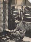 A maintenance engineer adjusts one of the ENIAC's portable function tables. The table here is being used to assist the computer's main mechanism in solving a problem; it is hooked into the two panels at right through bronze-encased cables, seen above the operator's head.