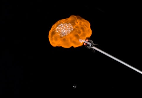 A hydrogen-filled soap bubble exploding when touched by a lighter.