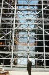 A gentleman looking up at the crossbeams that make up the VAB's structure.