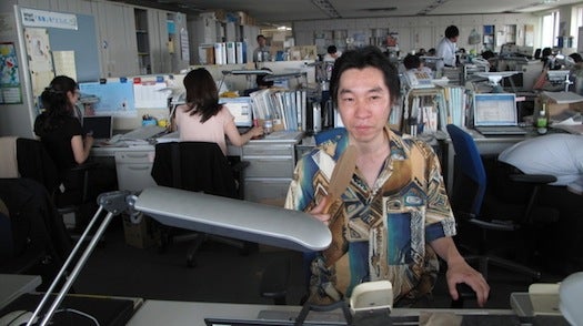 Koji Nakamura, who works in the Environment Ministry, says he thinks he could have been fired for wearing such a shirt last year. This year, he has become the ministry's poster boy for the Super Cool Biz energy-saving campaign because of his flamboyant style.