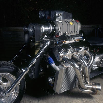A drag-racing motorcycle with a monster truck engine.
