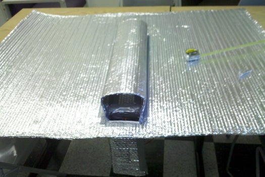 Cox's first prototype was built using foil-faced bubble wrap, duct tape, two fans and an arduino microcontroller for data logging. It was installed under a loft Cox had built in his studio.