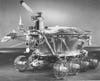 Though by this time Americans had already walked on the moon, the Soviets launched a series of lunar rovers to the moon between 1969 and 1977 under the program heading Lunokhod (or "moonwalker"). The first Lunokhod didn't make it through launch (it was given the designation "1A") but the second, Lunokhod 1, touched down at the moon's "Sea of Rains" on November 17, 1970, aboard the spacecraft Luna 17. Though the Soviets had lost the race to the moon, they did have something novel in Lunokhod 1. It was the first remote-controlled rover to land on another planetary body. Luna 17 deposited Lunokhod 1 on the lunar surface via dual ramps that deployed from the spacecraft. Once on the surface, Lunokhod 1 demonstrated many of the rover technologies that are still employed today: special lubricants that keep moving parts working at different atmospheric pressures, electric motors, a radioisotope heater to keep it warm during the lunar night, and solar panels that charge its batteries during the day. It operated for just short of one year, traveling more than 34,000 feet and transmitting 20,000 pictures during that time. It also created the modern paradigm for rovers that would be followed for decades.