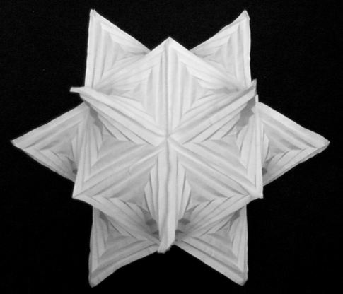 This paper sculpture doesn't exist according to the Demaines' calculations. It's a series of hyperbolic paraboloids linked together, which they dubbed a hyparhedron. The individual curved paraboloids in it have been folded by people for decades, but Erik and Marty proved earlier this year that you can't create a 3-D object based on the crease lines they were using. Somehow, miniscule creases are sneaking into the paper, allowing it to open. When the men made this sculpture in 1999, which was displayed at Southwestern College in Kansas, they still thought the shape existed. The sculpture was made along with Anna Lubiw, a professor at the University of Waterloo. The proof that the shape "doesn't exist" was done in collaboration with students Vi Hart at Stony Brook University, Greg Price at MIT, and Tomohiro Tachi at the University of Tokyo.