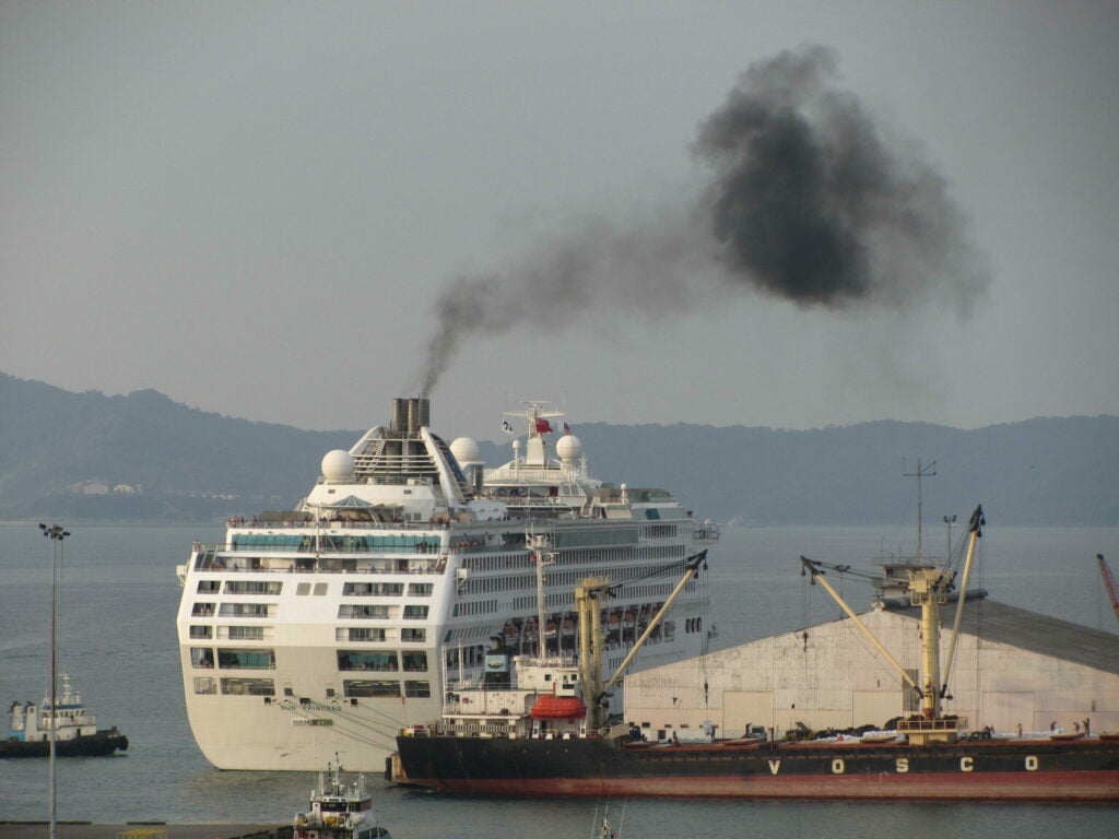 A black cloud billows from the smokestacks of the <em>Sun Princess</em> cruise ship.