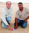 Jenniskens and student Mohammed Alameen with the first sample of asteroid 2008 TC3