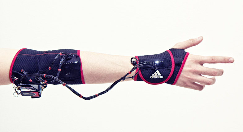 Haptic “Ghost” Armband Teaches Your Muscles To Behave Like Athletes’ Muscles