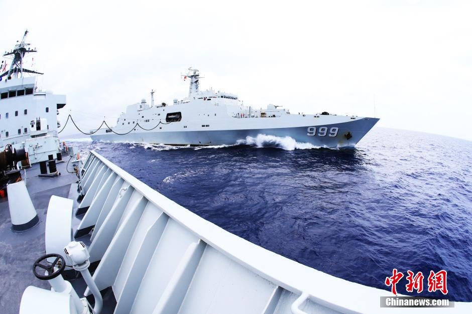During the March 2014 search and rescue operations in the South China Sea for MH 370, the Type 903 Weishanhu replenishment ship refuels the Type 071 Jianggang Shan landing platform dock.