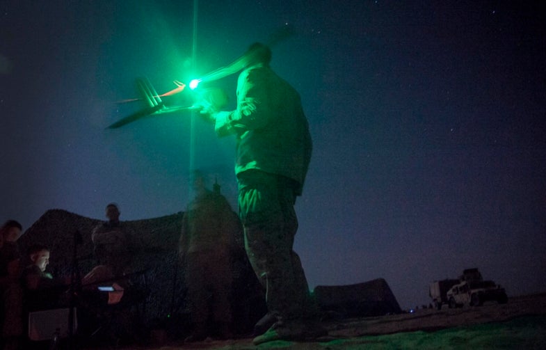 KUWAIT (Aug. 23, 2015) U.S. Marines with Lima Company, Battalion Landing Team 3rd Battalion, 1st Marine Regiment, 15th Marine Expeditionary Unit, prepare to launch an RQ-11 Raven during a training exercise. The Raven is a small, hand-launched, remote-controlled, unmanned aerial vehicle that has day and night aerial intelligence, surveillance, target acquisition, and reconnaissance capabilities. Elements of the 15th MEU are ashore in Kuwait for sustainment training to maintain and enhance the skills they developed during their pre-deployment training period. The 15th MEU is embarked with the Essex Amphibious Ready Group and deployed to maintain regional security in the U.S. 5th Fleet area of operations. (U.S. Marine Corps photo by Cpl. Elize McKelvey/Released)