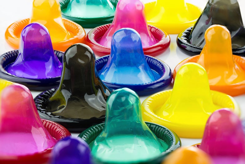 colorful condoms on a white background