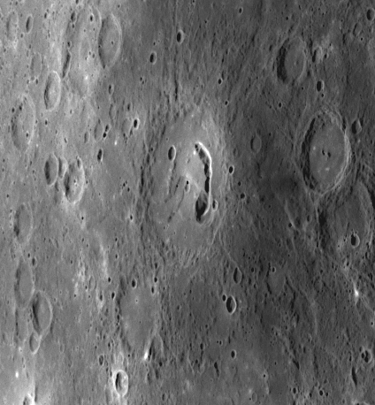 The unnamed crater in the center of the image was viewed at close range for the first time during <em>Messenger</em>'s third flyby of Mercury. It displays an arc-shaped depression known as a pit crater on its floor. Impact craters on Mercury that host pit craters in their interiors have been named pit-floor craters. The discovery of multiple pit-floor craters adds to the growing evidence for the presence of volcanic activity during the evolution of Mercury's crust.