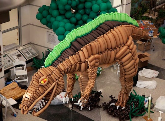 <a href="http://airgami.com/">Airigami</a> specializes in making crazy balloon sculptures, but they might've outdone themselves by making this 20-foot-long reproduction of the acrocanthosaurus, which was put alongside real dinosaur skeletons at the Virgina Museum of Natural History.