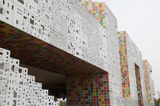Korea's large, colorful pavilion is an assemblage of Hangul characters stacked Lego-style, with colorful character tiles on the undersides.