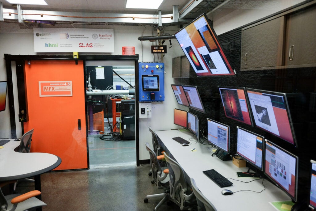 It's unsafe to be in the same room as the laser during the experiment, so scientists control and monitor the proceedings from a wall of monitors just outside.