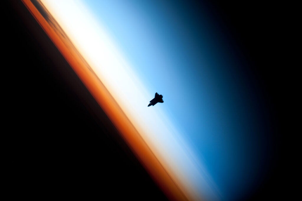 The Space Shuttle Endeavor above the Earth's atmosphere.