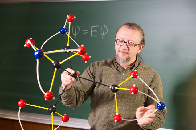 Professor Robert Zoellner holds a model of tetranitratoxycarbon. He has a co-authorship on a paper about the new molecule--along with ten-year-old Clara Lazen.