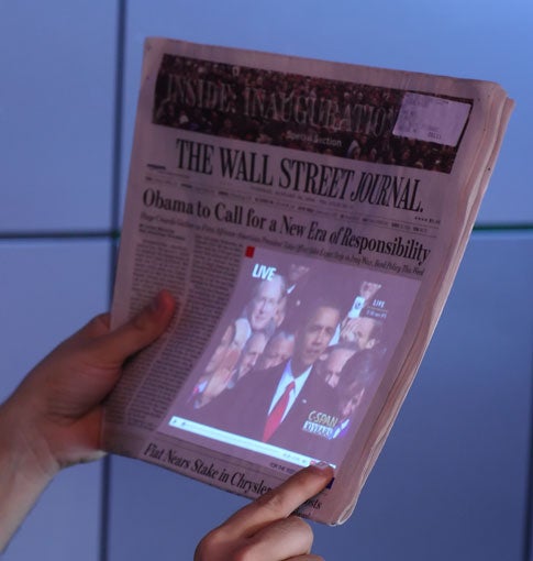 The SixthSense can scan newspaper stories and retrieve related video from YouTube or other Web sites, which it projects directly onto the surface of the paper