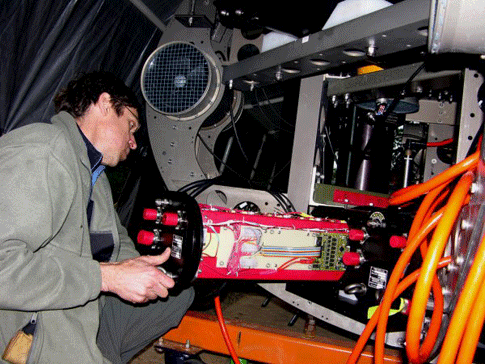 John Kerr carefully loading Battery Pod 1 into DepthX. Each of the two Lithium-Ion-battery stacks contains the energy equivalent of 6 pounds of TNT.