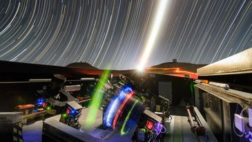 timelapse photo showing the Next-Generation Transit Survey at night, with instruments on