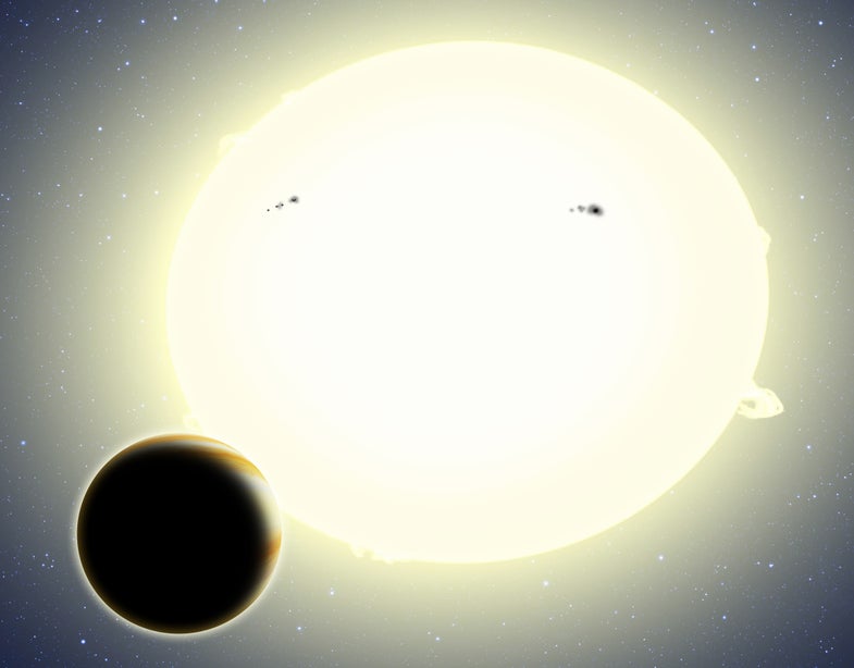 An artist's rendition of the newly discovered planet, Keplar-76b, and the star it orbits. The star has a slight elliptical shape that's been exaggerated in this illustration.