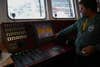 The Rainbow Warrior's captain of over 30 years, Peter Willcox, shows off the bridge. The computer screen shows the status of the ship's engine and generators.