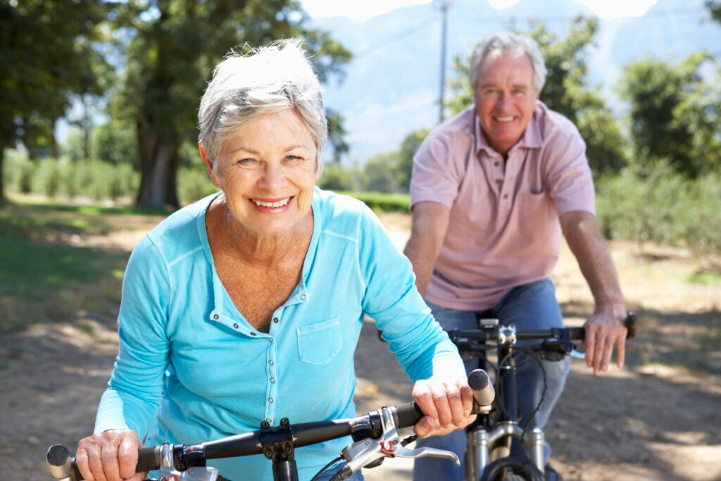 elderly couple bicycling