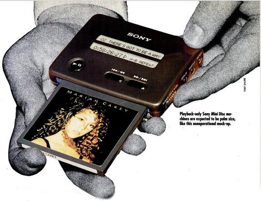 With records, cassette tapes and CDs all incompatible, Sony decided that what the people needed most was another form of recorded music. With portability in mind, they set about designing the Mini Disc system, which was supposed to have more compressed audio (pros: smaller discs, cons: lower quality), as well as the ability to be jostled without skipping - you could take it on a jog, perhaps. The advantage of choosing to compress the songs rather than develop a new recording technology was that companies would be able to use the same recording equipment they already had to produce the Mini Discs. The discs would also be erasable and re-recordable. Read the full story in Pocket-Size Recorder Plays Music on a Mini Disc