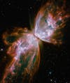 Captured by the Hubble Space Telescope in 2009, this photograph shows the death of a star. As its internal nuclear furnace begins to fail, its outer layers are expelled back into space, creating a butterfly effect.