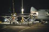 A crew loads the HB-SIA solar plane's 208-foot-long wing into the nose of a 747. Engineers will rebuild it once it lands in San Francisco for a coast-to-coast flight that begins this month.