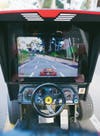 Custom software renders the road ahead in 8-bit augmented-reality graphics. Anything else in front of the cameras appears onscreen as well.