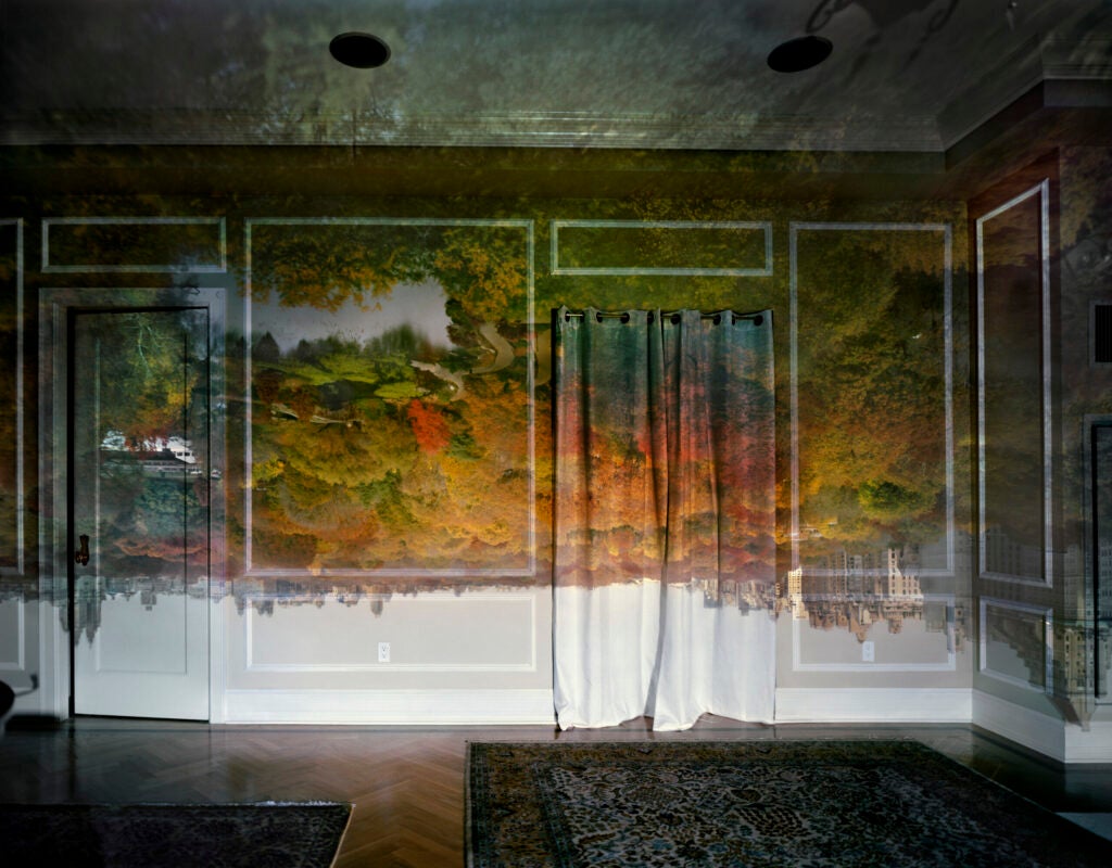 Photographer <a href="http://www.abelardomorell.net/">Aberlardo Morell</a> transformed this darkened room into a dreamscape by turning it into a camera obscura, a dark chamber with a pinhole on one side. When the light from an outside scene passes through the hole of a camera obscura, that image is reproduced and turned upside down. If you like what you see, check out this <a href="http://ngm.nationalgeographic.com/2011/05/camera-obscura/morell-photography">gallery</a> of Morell's work on <em>National Geographic</em>.