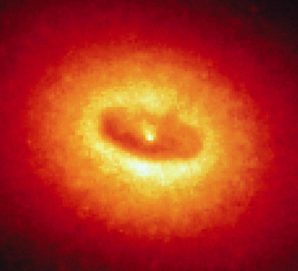 An orange ring of gas at the core of the galaxy NGC 4261