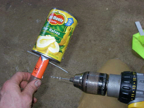Make sure the tube doesn't protrude all the way into the can. Drill a hole through the can flaps and the end of the snorkel tube. Insert a wire through the holes. Bend the ends of the wire over. The assembly will feel pretty secure.