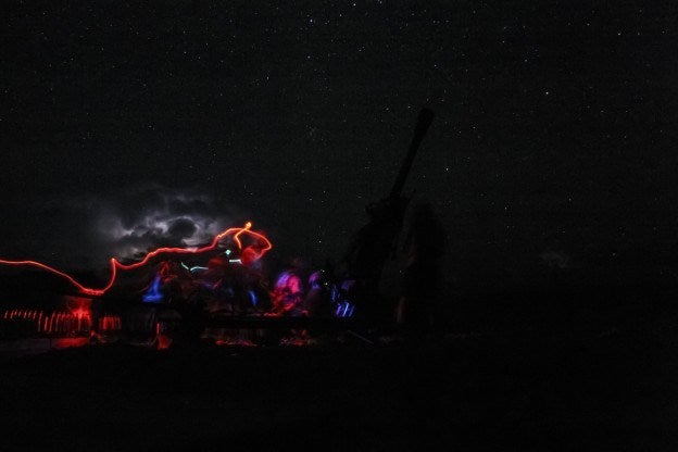 Photographer Simon Klingert caught this photo in Afghanistan, sometime in the summer of 2007. U.S. soldiers fired 155 mm shells at an enemy position, and the photo also captured light from the soldiers' headlamps and an approaching thunderstorm. See more of Klingert's work at his site.