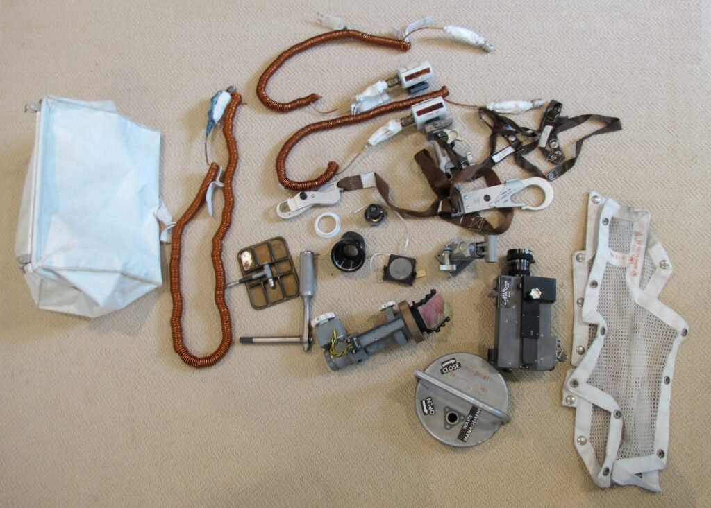 photo of the contents of the Apollo 11 purse, laid out on a carpet