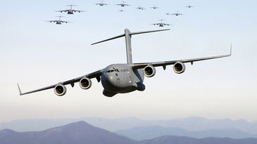 Thirteen C-17s flying over the Blue Ridge mountains