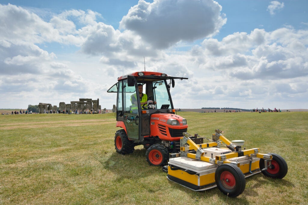 A tractor pushes an antenna array designed to study buried remains of monuments.
