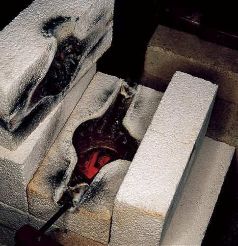 The charred inside of a firebrick furnace.