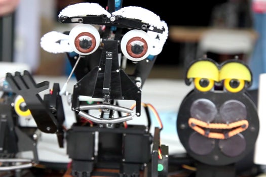 Handmade robots at NYC's 2012 Maker Faire dance in sync to music.
