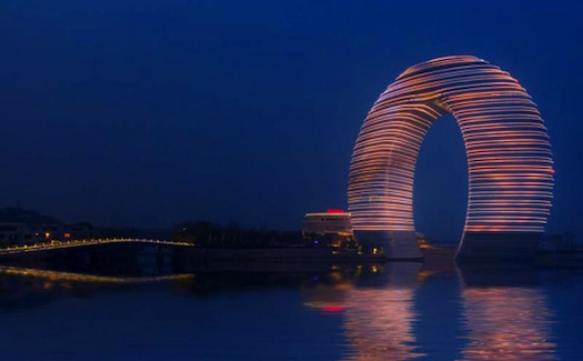 This Mind-Blowing, Horseshoe-Shaped Neon Hotel Can Light Up The Skyline