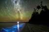 This long-exposure image shows stars over Gippsland Lakes in Victoria, Australia. In the water are bioluminescent plankton.