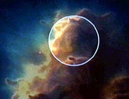 The circled area in the Hubble image shows what many people perceived to be the face of Jesus.