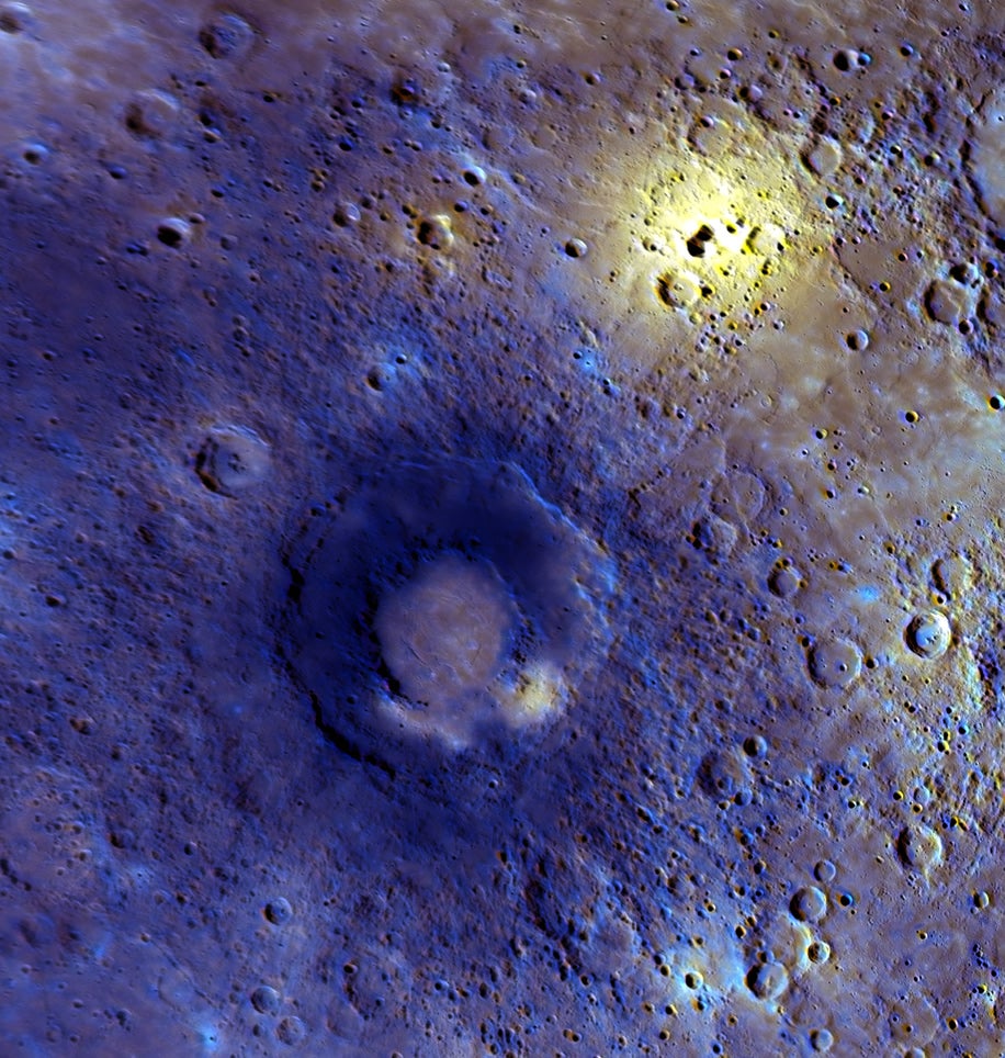 This enhanced-color view was created with a statistical technique that highlights subtle color variations often related to composition. Merged with images from the higher-resolution camera, the two sets of observations tell the story of the geology of the area and the compositional differences of the features observed. This region, viewed in detail for the first time during the third flyby, appears to have experienced a high level of volcanic activity. The bright yellow area near the top right is centered on a rimless depression that is a candidate site for an explosive volcanic vent. The double-ring basin in the center of the image has a smooth interior that may be the result of effusive volcanism. Smooth plains, thought to be a result of earlier episodes of volcanic activity, cover much of the surrounding area.