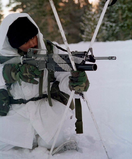 970208-M-8708Y-004 A 1st Platoon, Lima Company Marine uses his ski poles to steady his M-16A2 rifle during a live fire exercise at the Mountain Warfare Training Center, Bridgeport, Calif., on Feb. 8, 1997. Marines from the 2nd Marine Regiment and 3rd Battalion, 8th Marines of Camp Lejeune, N. C., were at the Center to train in cold weather survival and arctic warfare. This M-16A2 is equipped with a M-203 40 mm grenade launcher. DoD photo by Lance Cpl. E.J. Young, U.S. Marine Corps.