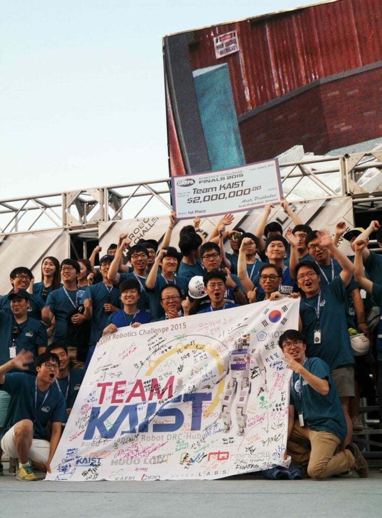 Team KAIST posing after winning the DRC