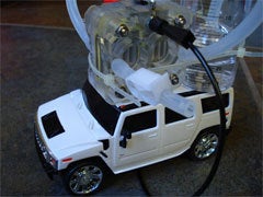 A DIY fuel cell on top of a white RC Hummer.